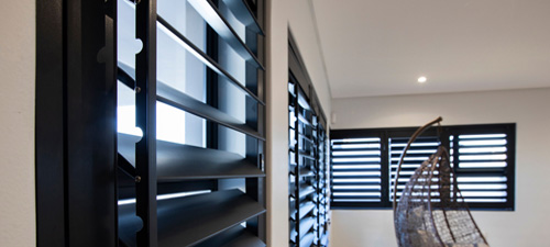 Security plantation shutters in dark grey finish